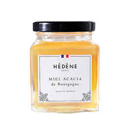 Pot de miel de la marque Hélène. L'étiquette au milieu du pot montre que c'est un miel Acacia de Bourgogne avec un drapeau français également au dessus